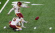 Kicker Dustin Hopkins (3) of the Washington Football Team kicks the ball during the first...