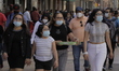 A large number of people walk along the Madero corridor in the Zócalo of Mexico City as pa...