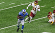 Running back Adrian Peterson (28) of the Detroit Lions carries the ball under the pressure...