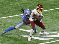Wide receiver Terry McLaurin (17) of the Washington Football Team is tackled by cornerback Desmond Trufant (23) of the Detroit Lions during...