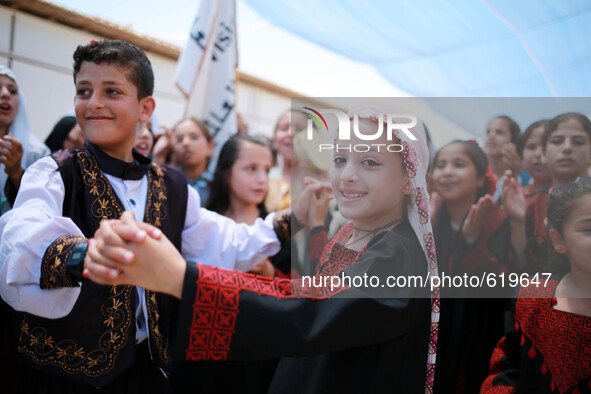 Within psychological support programs for children and entertaining celebration of dance and popular Dabke in Gaza