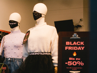 Balck Friday sale sign is seen inside the store as Mannequins with face masks are seen in Cologne city center, on November 19, 2020.  (