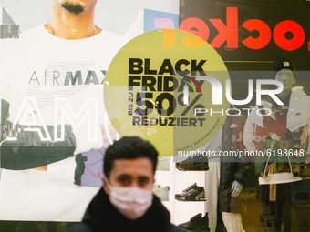 Balck Friday sale sign is seen inside the store  in Cologne city center, on November 19, 2020.  (