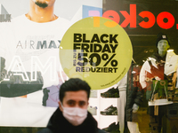 Balck Friday sale sign is seen inside the store  in Cologne city center, on November 19, 2020.  (