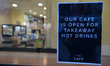 A sign 'Our Cafe Is Open For Takeaway Hot Drinks' seen in a shop window in Dublin's city c...