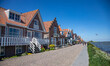 Daily life in Volendam traditional fishing village with Dutch architecture in North Hollan...