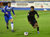   Oldham Athletic's Cameron Borthwick-Jackson tussles with Barrow's Scott Quigley during the Sky Bet League 2 match between Barrow and Oldha...