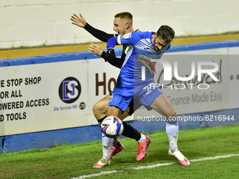   Oldham Athletic's Davis Keillor-Dunn tussles with Barrow's Bradley Barry during the Sky Bet League 2 match between Barrow and Oldham Athle...
