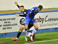   Oldham Athletic's Davis Keillor-Dunn tussles with Barrow's Bradley Barry during the Sky Bet League 2 match between Barrow and Oldham Athle...