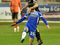   Oldham Athletic's Carl Piergianni heads away the ball from Barrow's Harrison Biggins during the Sky Bet League 2 match between Barrow and...