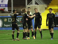 Danny Rowe celebrates with his team mates after scoring their  third goal from the penalty spot   during the Sky Bet League 2 match between...