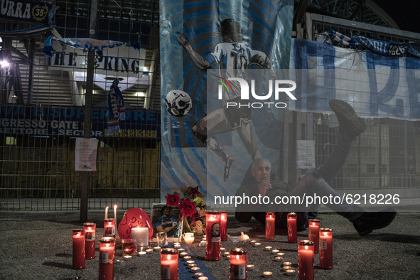 Neapolitan fans pay tribute outside of 'San Paolo' Stadium where in 1987 Maradona played and lead the local team to win the national league,...