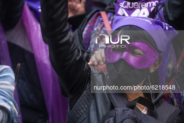A woman with a mask participate in the Day of non-violence against women in Bogota, Colombia, on November 25, 2020 