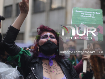 A woman participates in the Day of non-violence against women in Bogota, Colombia, on November 25, 2020 (