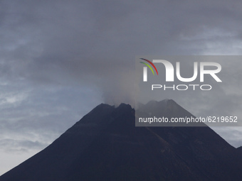 Solfatara smoke spews from the top of Merapi volcano as seen from Yogyakarta, on November 26, 2020. The activitiy of Merapi volcano is conti...