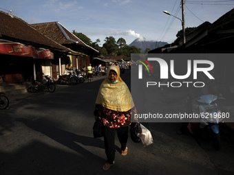 The morning activities of local residents at Butuh traditional market, about 14 kilometers from the summit of mount Merapi, as the solfatara...