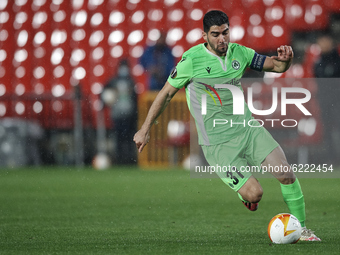 Giannis Kousoulos of Omonoia runs with the ball during the UEFA Europa League Group E stage match between Granada CF and AC Omonoia at Estad...