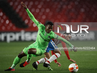 Abdullahi Shehuof Omonoia and Luis Milla of Granada compete for the ball during the UEFA Europa League Group E stage match between Granada C...