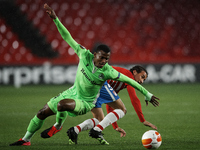 Abdullahi Shehuof Omonoia and Luis Milla of Granada compete for the ball during the UEFA Europa League Group E stage match between Granada C...