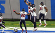Houston Texans defensive end J.J. Watt (99) celebrates with teammates after making a touch...