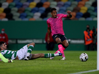 Walterson Silva of Moreirense FC (R ) shoots to score during the Portuguese League football match between Sporting CP and Moreirense FC at J...