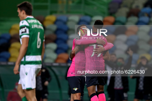 Walterson Silva of Moreirense FC (R ) celebrates with Andre Luis after scoring during the Portuguese League football match between Sporting...