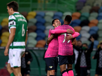 Walterson Silva of Moreirense FC (R ) celebrates with Andre Luis after scoring during the Portuguese League football match between Sporting...