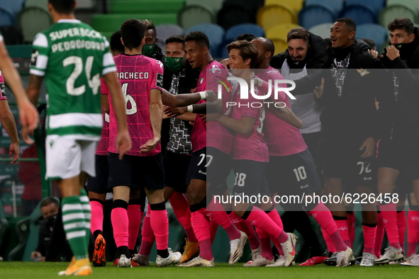 Walterson Silva of Moreirense FC (77 ) celebrates with teammates after scoring during the Portuguese League football match between Sporting...