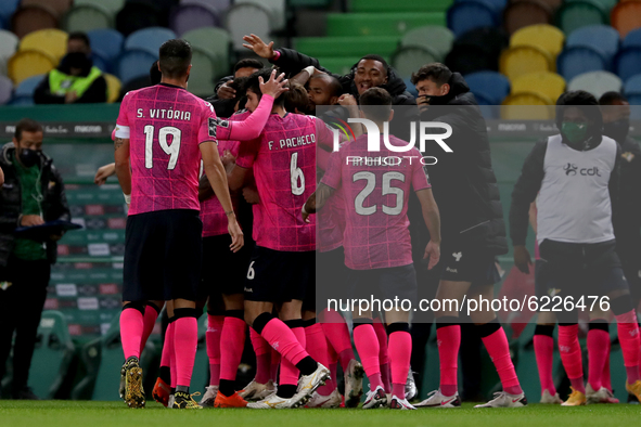 Walterson Silva of Moreirense FC (77 ) celebrates with teammates after scoring during the Portuguese League football match between Sporting...