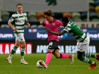Goncalo Franco of Moreirense FC (C ) vies with Nuno Mendes of Sporting CP (R ) during the Portuguese League football match between Sporting...