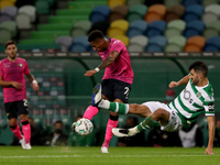 Walterson Silva of Moreirense FC (C ) vies with Luis Neto of Sporting CP during the Portuguese League football match between Sporting CP and...
