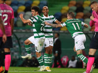 Pedro Goncalves of Sporting CP (L ) celebrates with teammates after scoring during the Portuguese League football match between Sporting CP...