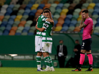 Pedro Goncalves of Sporting CP (C ) celebrates with Luis Neto after scoring his second goal during the Portuguese League football match betw...