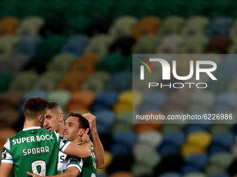Pedro Goncalves of Sporting CP (R ) celebrates with teammates after scoring his second goal during the Portuguese League football match betw...