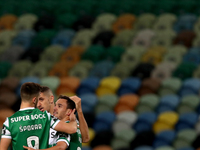 Pedro Goncalves of Sporting CP (R ) celebrates with teammates after scoring his second goal during the Portuguese League football match betw...