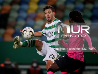 Pedro Goncalves of Sporting CP (L ) vies with David Tavares of Moreirense FC during the Portuguese League football match between Sporting CP...