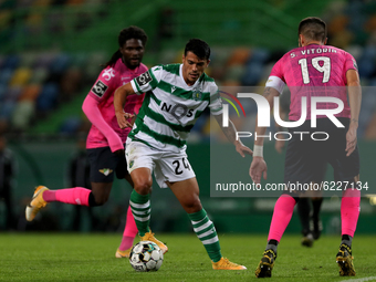 Pedro Porro of Sporting CP (L) vies with Steven Vitoria of Moreirense FC during the Portuguese League football match between Sporting CP and...