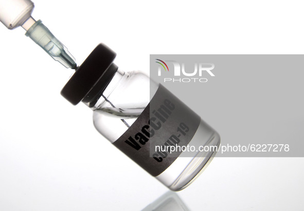 A medical syringe and a vial with a sticker reading Vaccine COVID-19 are seen in this creative illustrative photo. More than one hundred fif...
