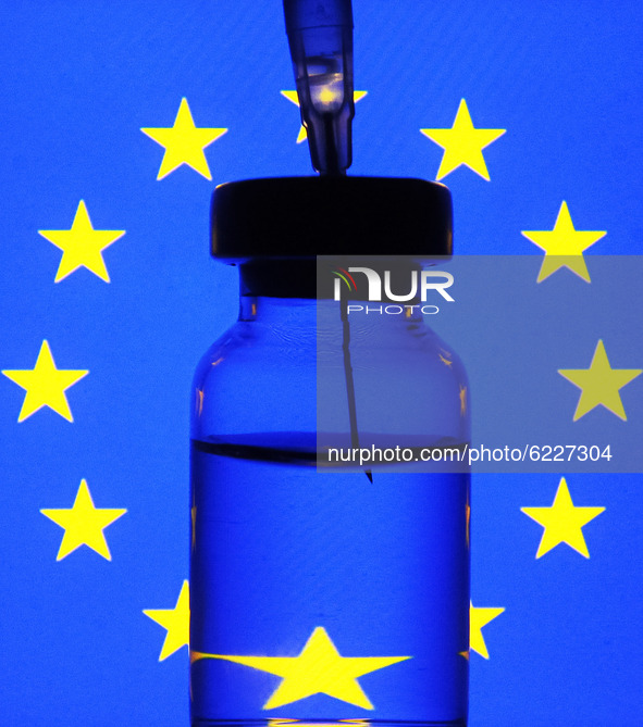 A medical syringe and a vial in front of the EU flag are seen in this creative illustrative photo. More than one hundred fifty COVID-19 coro...