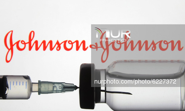 A medical syringe and a vial in front of the Johnson & Johnson logo are seen in this creative illustrative photo. More than one hundred fift...