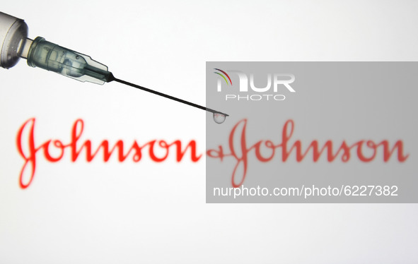 A medical syringe in front of the Johnson & Johnson logo is seen in this creative illustrative photo. More than one hundred fifty COVID-19 c...