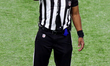 Umpire Shawn Smith (14) makes a call during the second half of an NFL football game betwee...