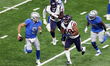 Detroit Lions quarterback Matthew Stafford (9) carries the ball while being pursued by Hou...