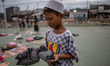 Children play at a slum area in Jakarta on 29 November, 2020. Indonesia’s economy is expec...