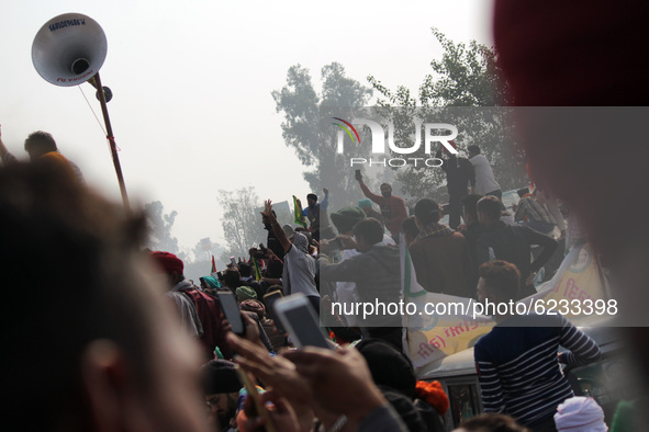 Farmers shout slogans during a protest against the Centre's new farm laws at Singhu border near Delhi, India on November 30, 2020. Farmers f...