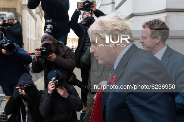 British Prime Minister Boris Johnson returns to Downing Street in central London after attending weekly Cabinet meeting held at the Foreign...