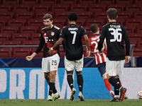 Thomas Muller of Bayern celebrates after scoring his sides first goal during the UEFA Champions League Group A stage match between Atletico...