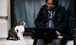 Resident cat Larry sits beside a photographer working opposite 10 Downing Street in London...