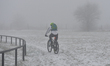 A cyclist seen in foggy weather near the Krakus Mound in Krakow.On Friday, December 11, 2...