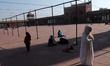 Muslim women offer prayers following safety protocols such as social distancing inside a m...